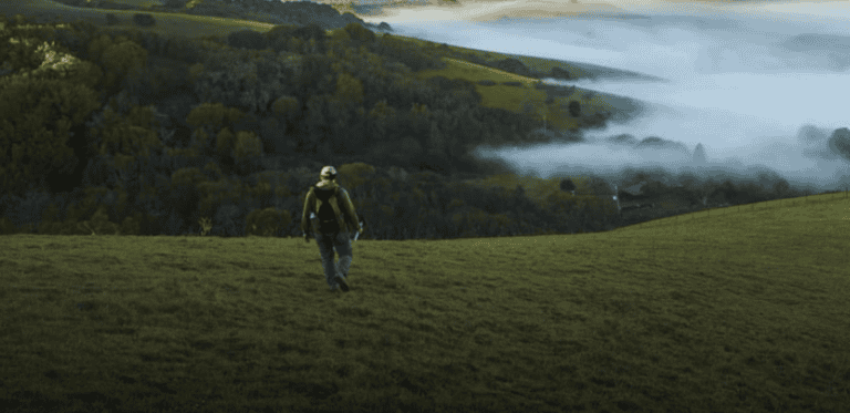 Person hiking on trail.